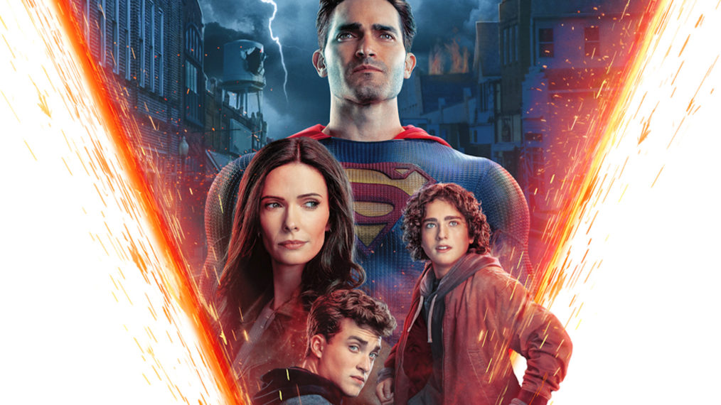Bright Laser beams crossing from left to right. Centre: 4 characters (Superman, Lois Lane and their sons, Jordan and Jonathan)