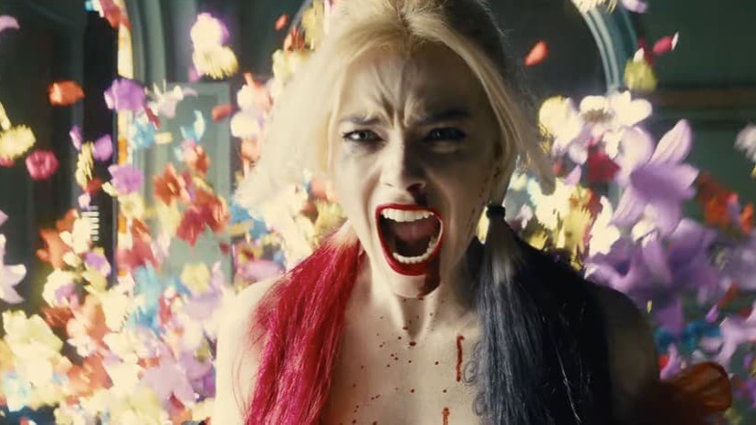 Margot robbie harley quinn in The Suicide Squad movie screaming and confetti exploding