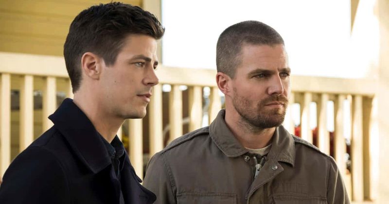 Grant Gustin as Barry Allen and Stephen Amell as Oliver Queen in The Flash