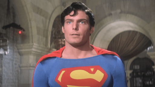 Christopher Reeve dressed in red, blue and yellow Superman suit