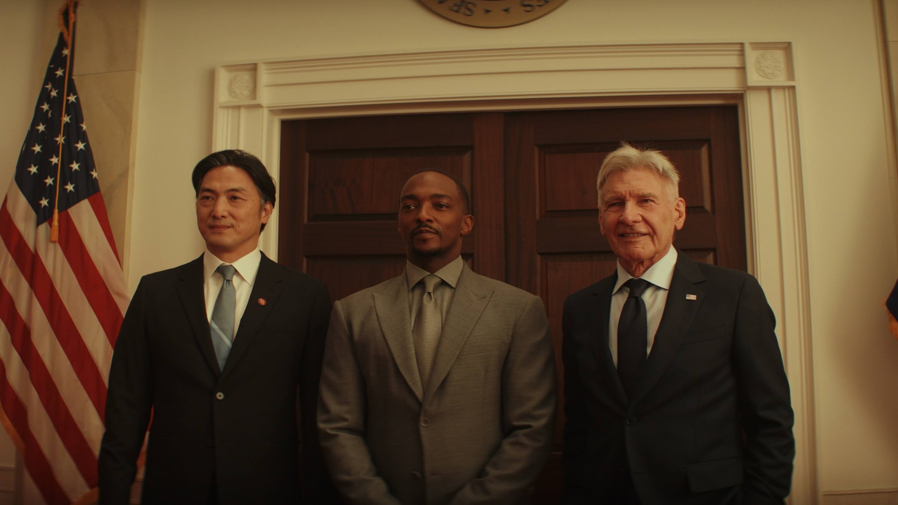 Politician standing next to Sam Wilson and President Ross at the White House in Captain America: Brave New World