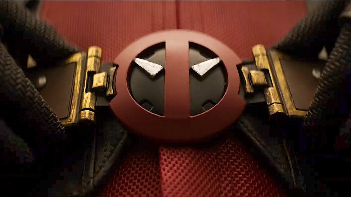 Deadpool suits up in the teaser trailer, putting on his belt with his personalized symbol