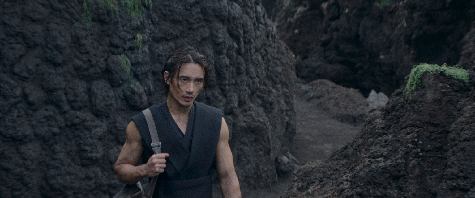 Quimir also known as the stranger is standing there on an island talking to Osha (out of frame)