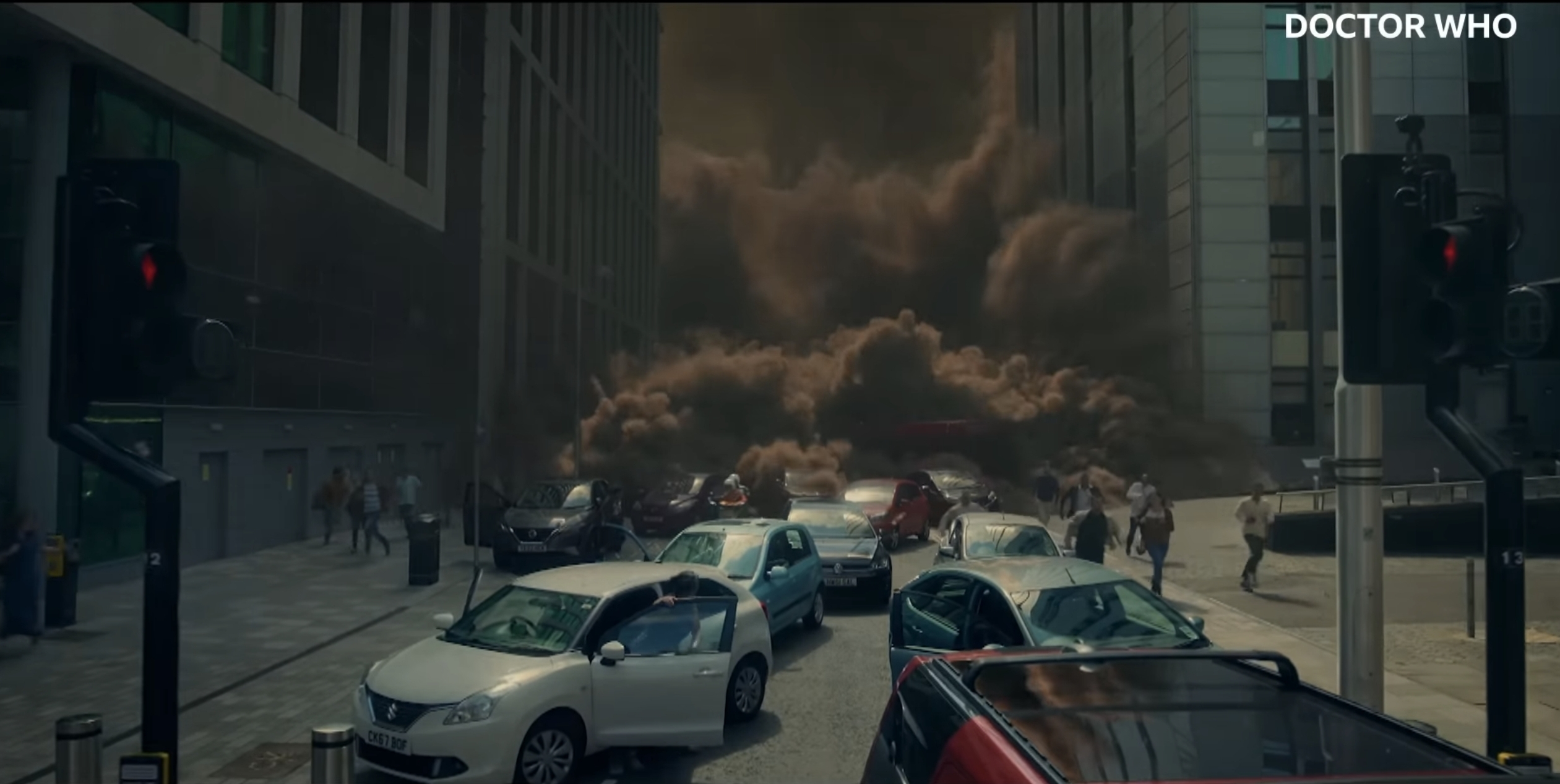 People running from a sandstorm