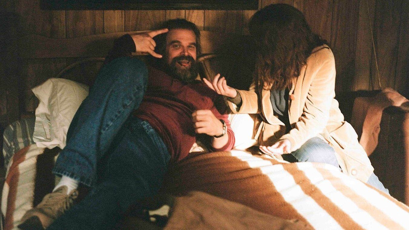 David Harbour and Winona Ryder posing for the camera on Stranger Things 5