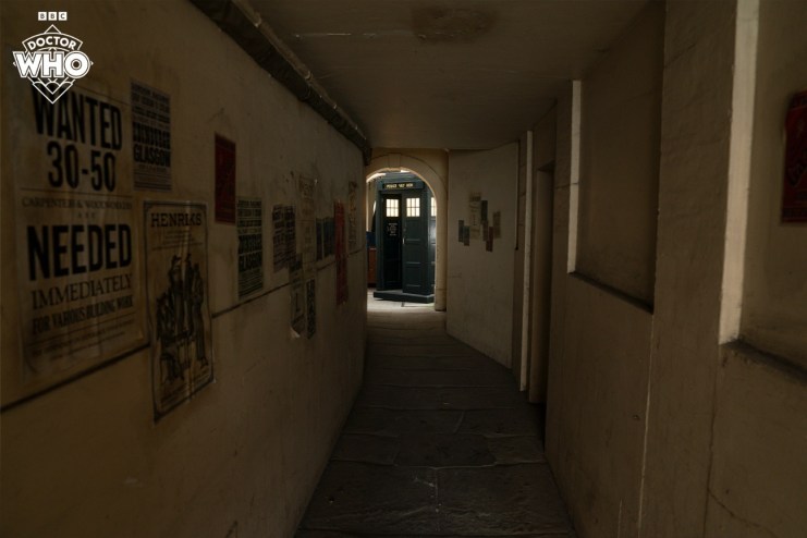 The TARDIS parked in an alleyway, in the 1920s.