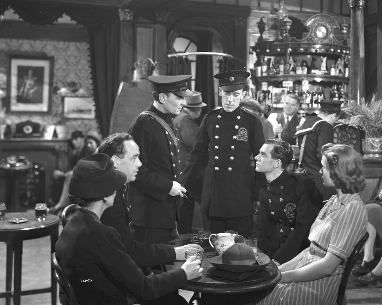 Characters dressed in The Auxiliary Fire Service uniform, in The Bells Go Down