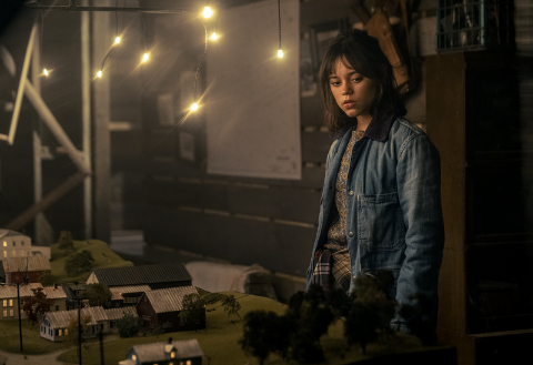 Astrid is standing in the attic once owned by the Maitlands, in Beetlejuice Beetlejuice.