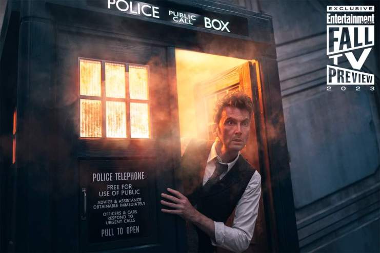 The Doctor (David Tennant) leaning out of the TARDIS, misty orange smoke behind him