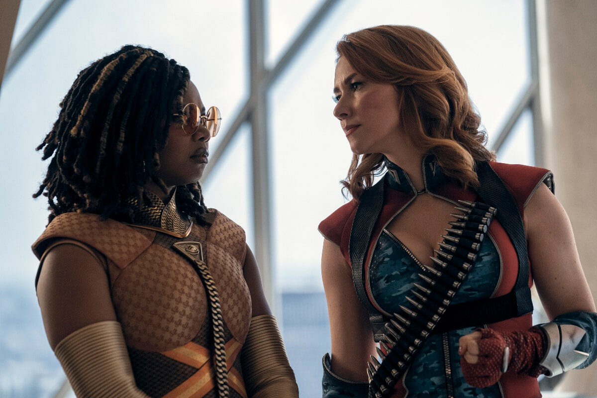 Sister Sage and Firecracker both standing there in their super suits looking at eachother in a scene from The Boys.