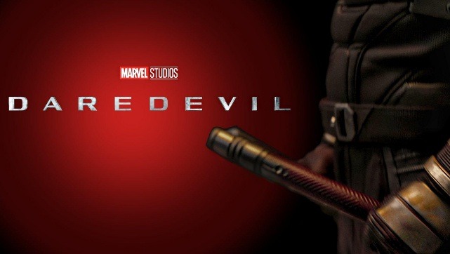 Red and yellow Daredevil suit in She-Hulk with the title card next to it reading 'Daredevil'. Red and black polarized background
