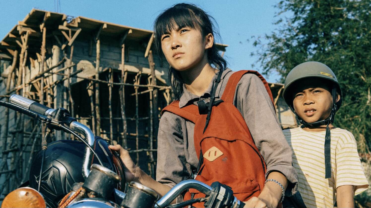 Two kids on a bike in Laos