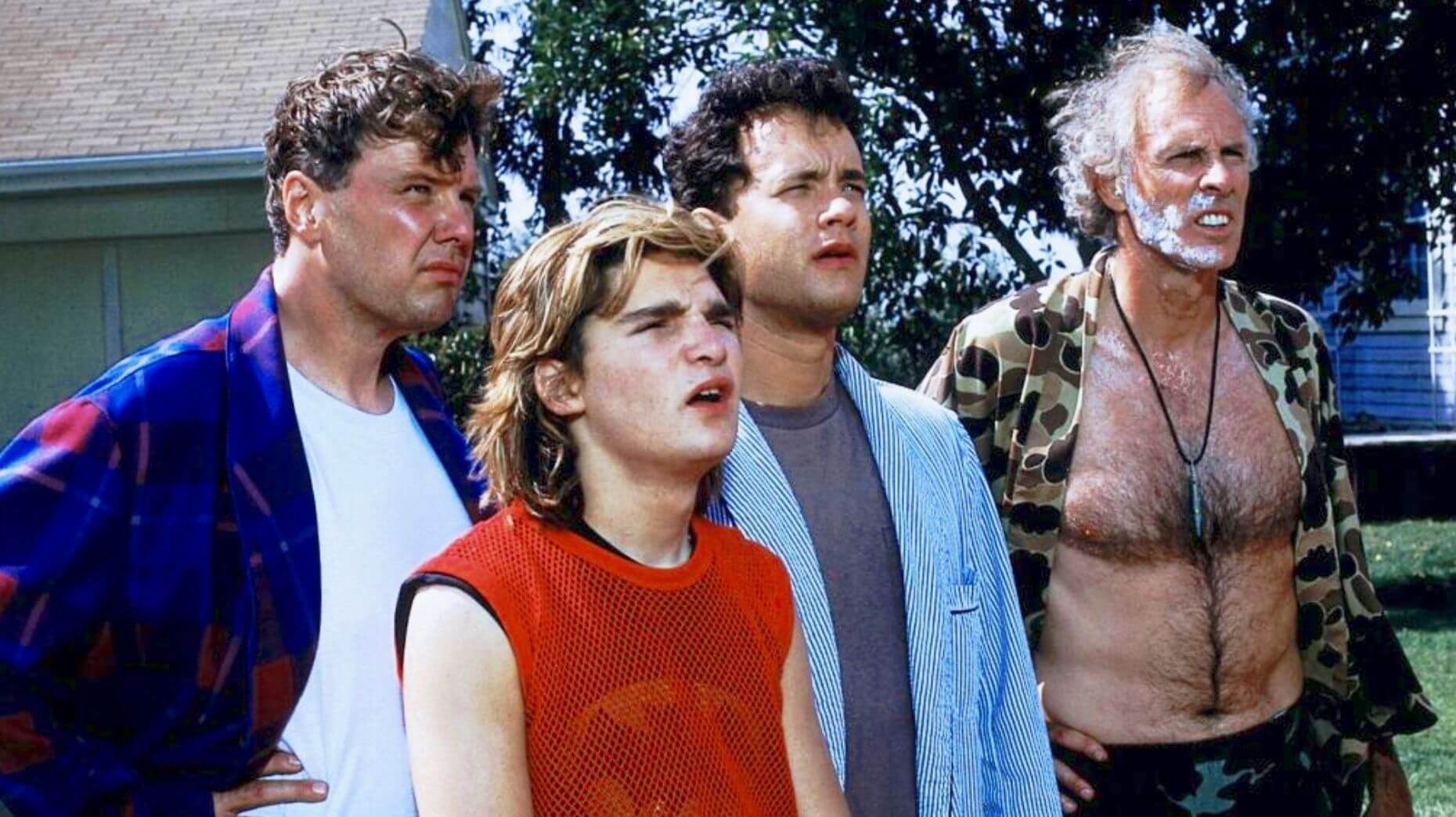 Ray Ducommon, Tom Hanks, Corey Feldman and Bruce Dern standing in the garden in comedy horror film The Burbs