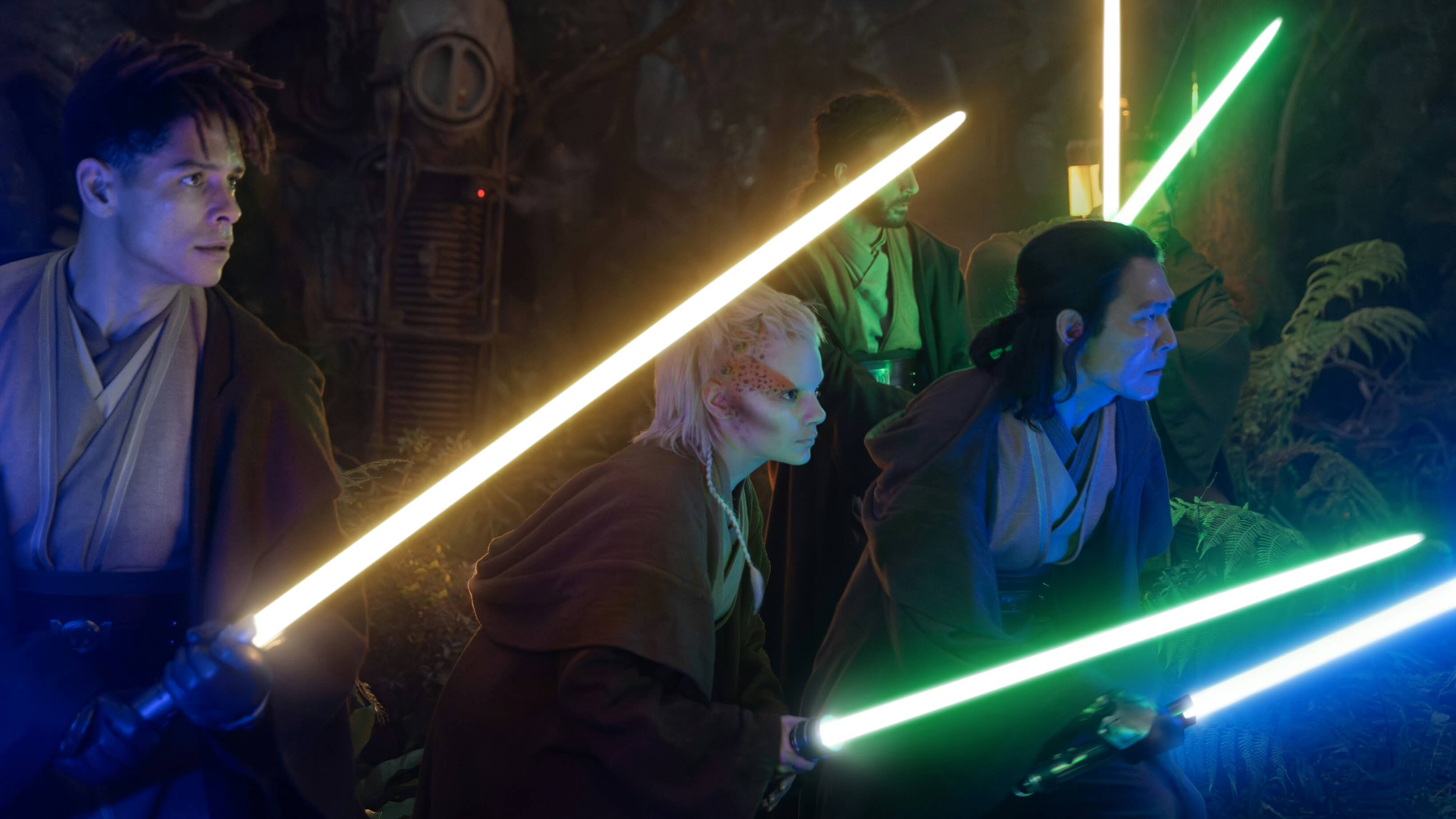 The Jedi are holding lightsabers and preparing to fight a threat from the darkside