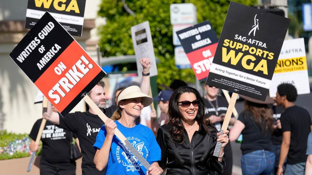 WGA and SAG-AFTRA trade unions are now on strike in the streets outside studios