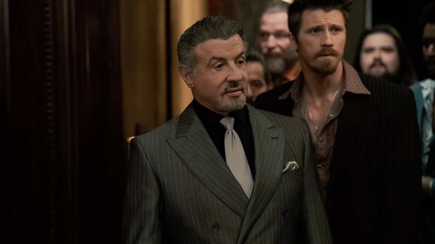 Sylvester Stallone in Tulsa King, with Garrett Hedlund standing next to him