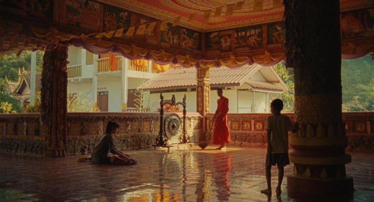 Kids standing inside a monastery.