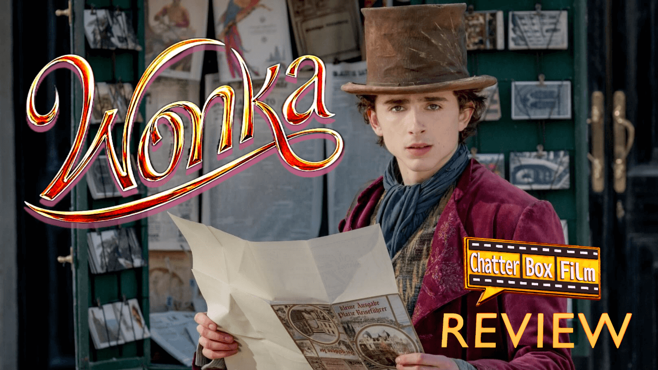 Timothée Chalamet as Willy Wonka, holding a map outside a magazine stand
