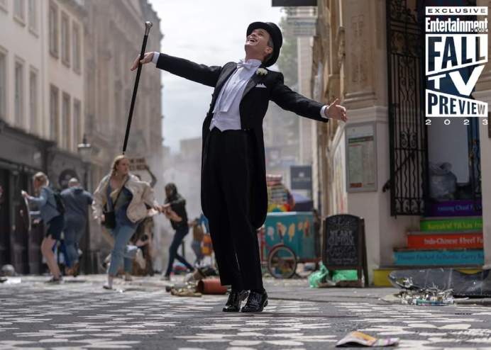 Neil Patrick Harris wearing a victorian suit and tophat in London