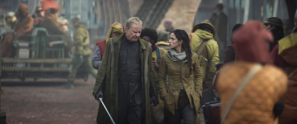 (L-R): Luthen Rael (Stellan Skarsgard) and Bix Caleen (Adria Arjona) in Lucasfilm's ANDOR, exclusively on Disney+. ??2022 Lucasfilm Ltd. & TM. All Rights Reserved.