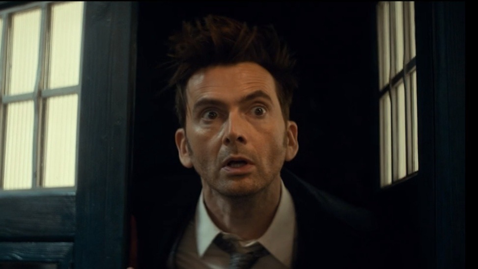 David Tennant as the Fourteenth Doctor looking out of a TARDIS