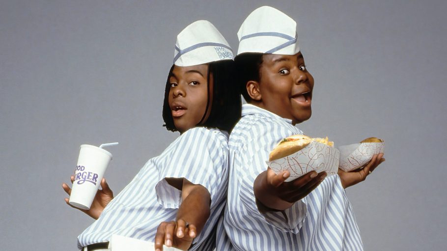 Kenan Thompson and Kel Mitchell holding burgers and a drink, wearing restaurant worker outfits