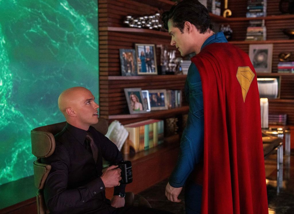 Lex Luthor is sitting down with a cup in his hand as Superman confronts him about his missing dog.