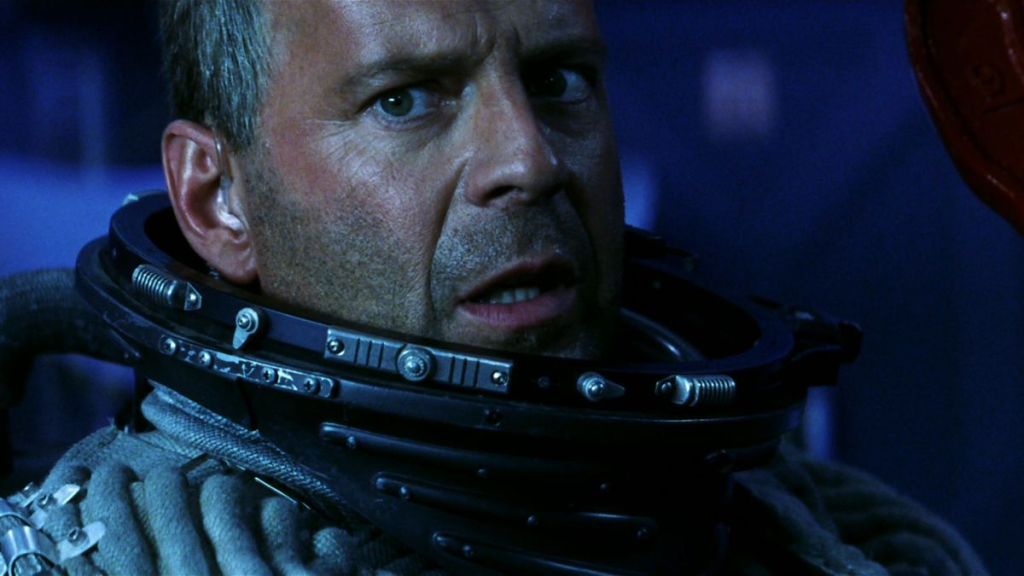 Harry Stamper (Bruce Willis) is in space, wearing an astronaut suit as he attempts to save the Earth from Armageddon.