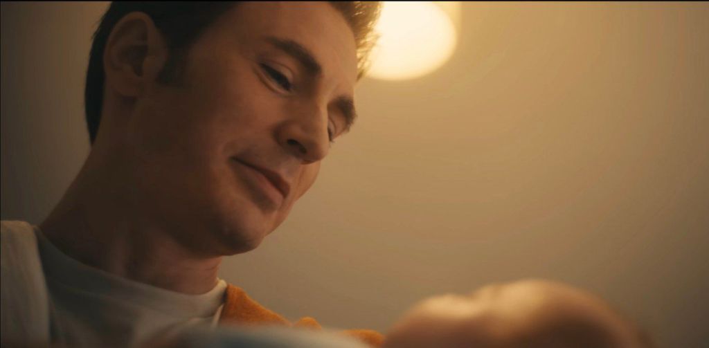 Chris Evens as Steve Rogers, holding his baby.